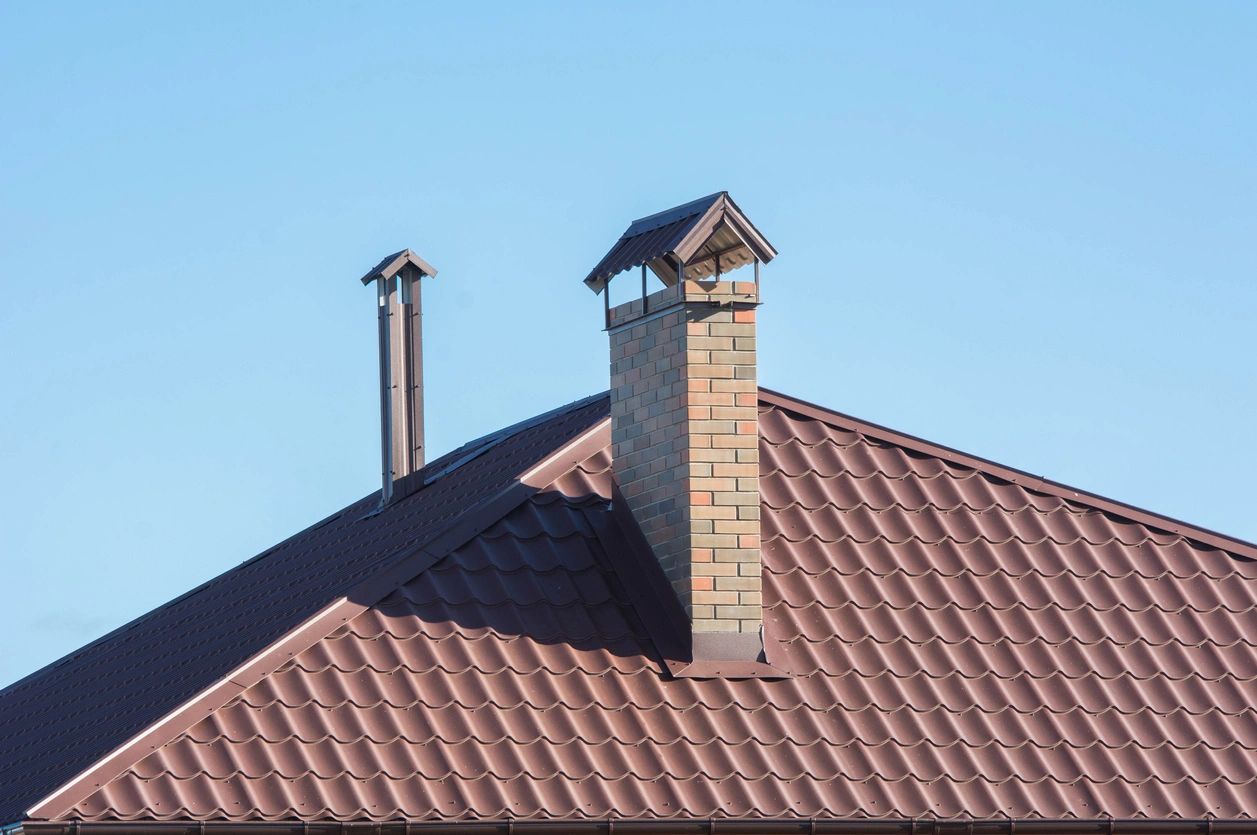 Residential roof with chimneys and terracotta tiles